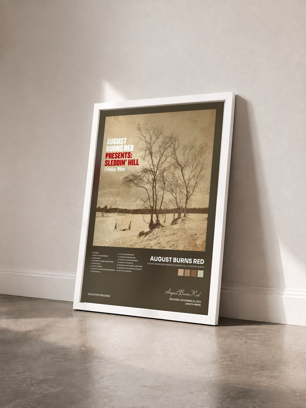 #blanc Tableau de l'album August Burns Red Presents: Sleddin' Hill, A Holiday Album de August Burns Red vu de trois quarts, cadre blanc