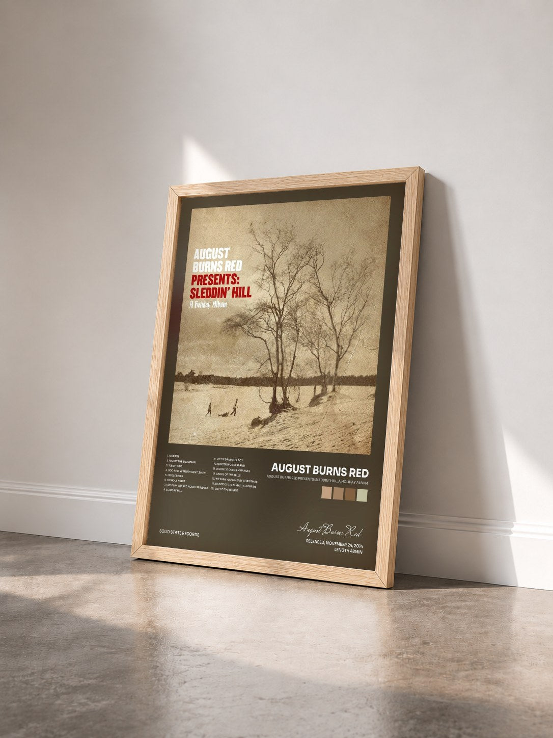 #bois Tableau de l'album August Burns Red Presents: Sleddin' Hill, A Holiday Album de August Burns Red vu de trois quarts, cadre en bois brut