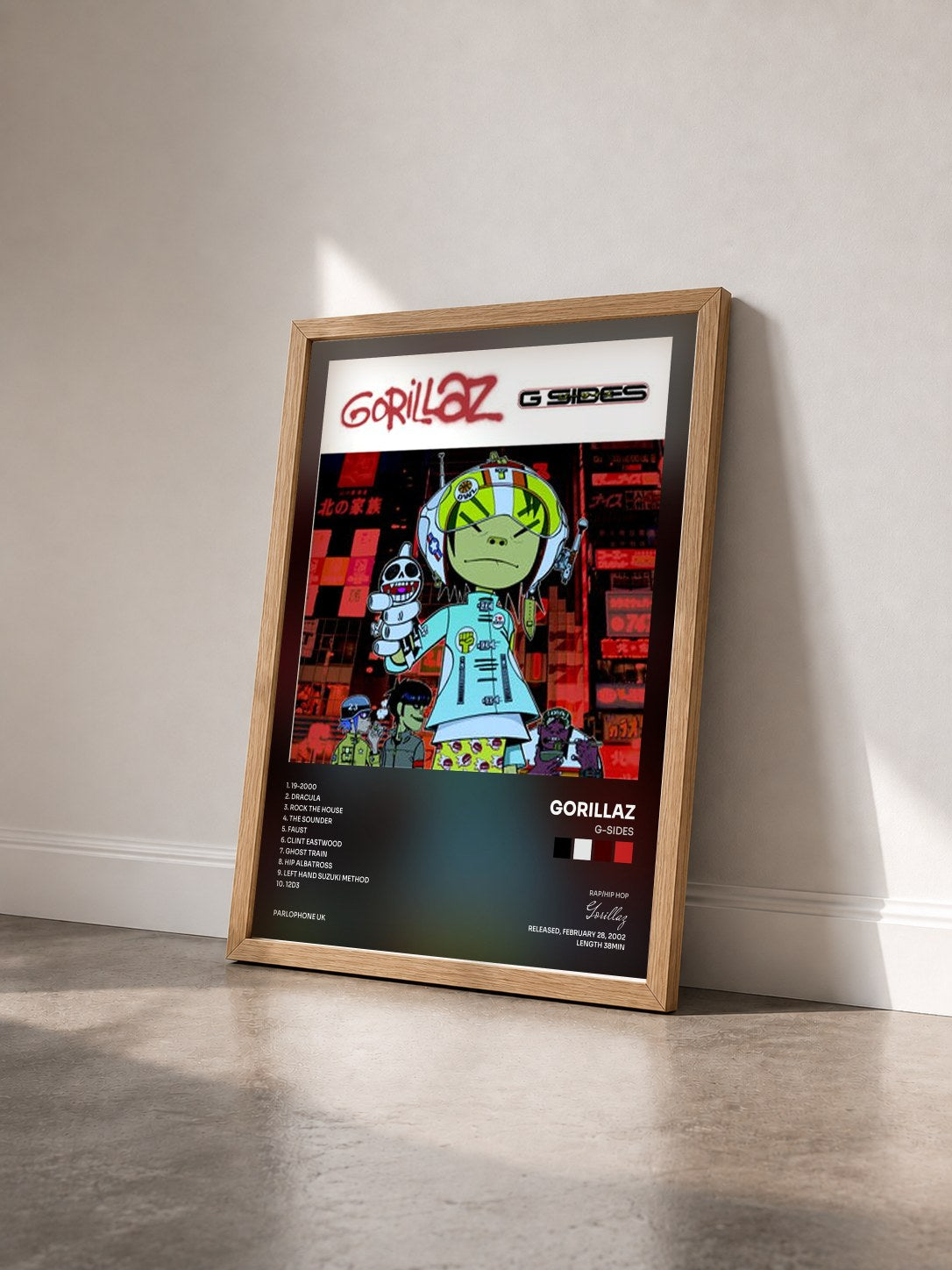 #bois Tableau de l'album G-Sides de Gorillaz vu de trois quarts, cadre en bois brut