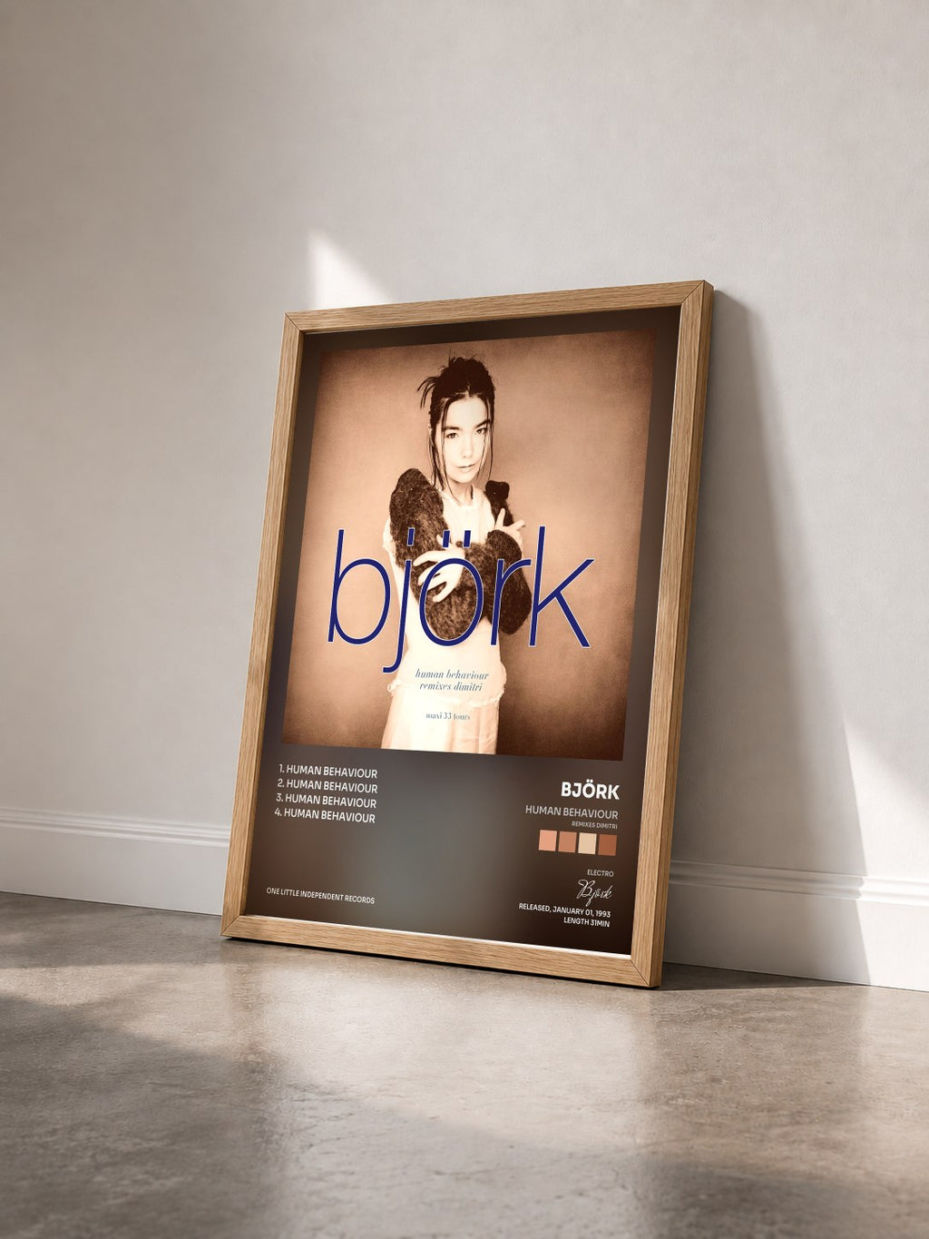 #bois Tableau de l'album Human Behaviour (Remixes Dimitri) de Björk vu de trois quarts, cadre en bois brut