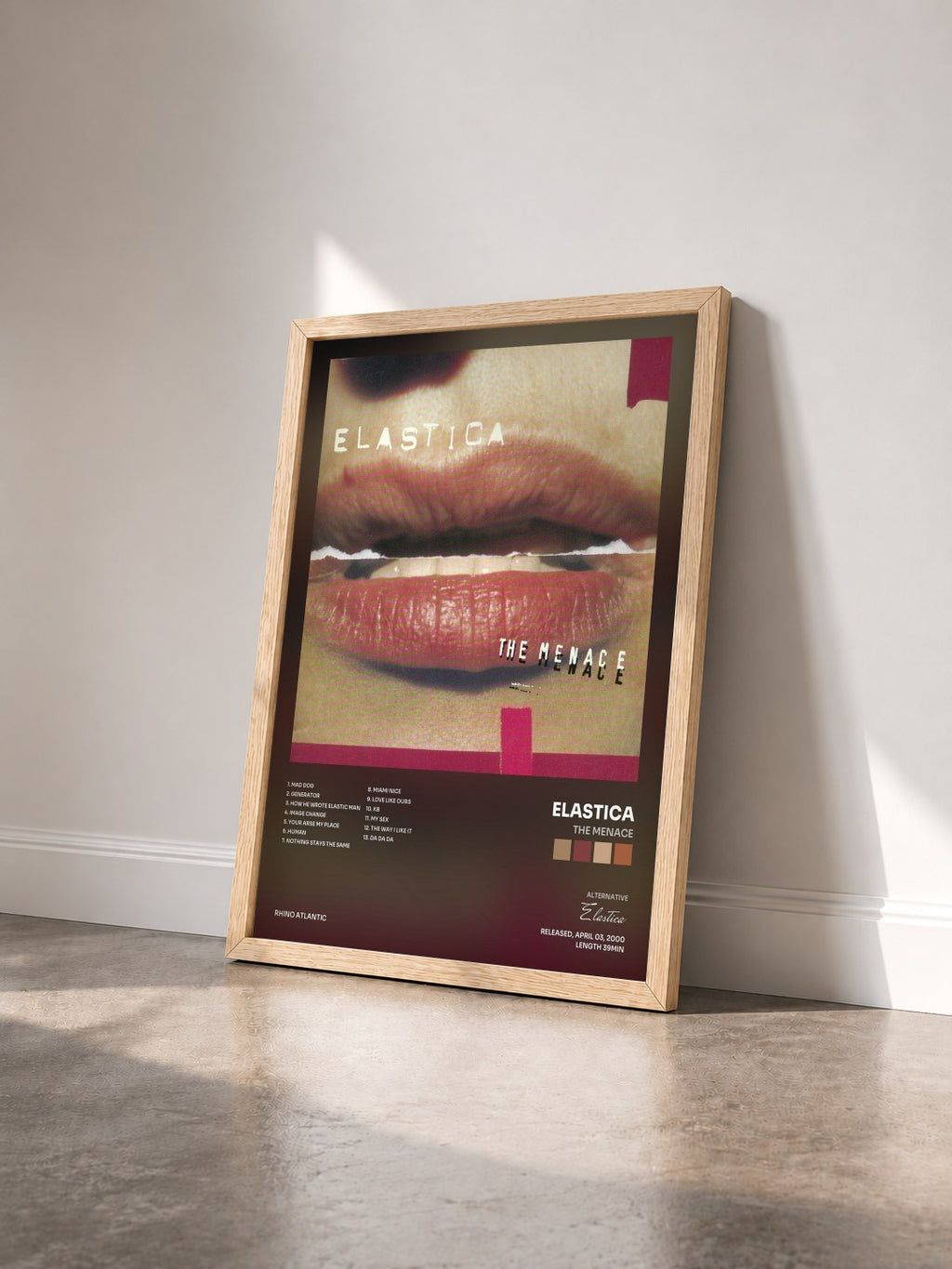 #bois Tableau de l'album The Menace de Elastica vu de trois quarts, cadre en bois brut