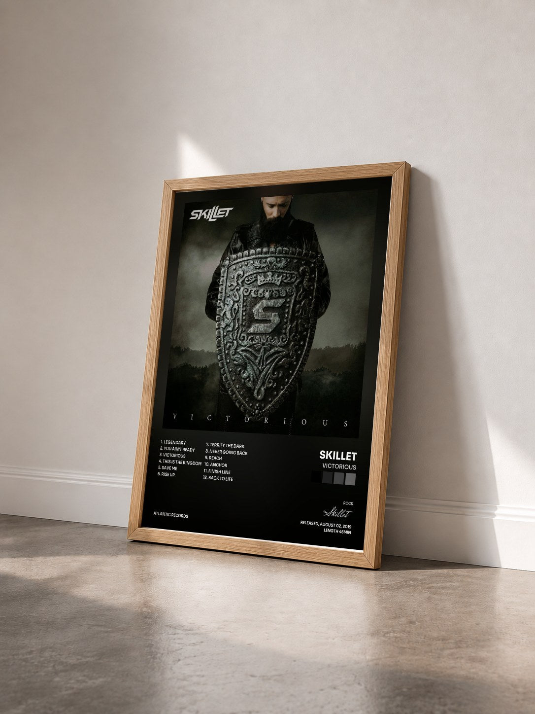 #bois Tableau de l'album Victorious de Skillet vu de trois quarts, cadre en bois brut