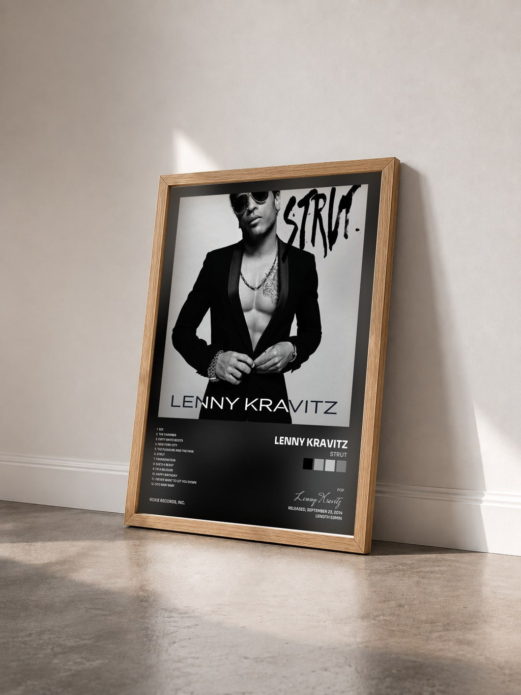 #bois Tableau de l'album Strut de Lenny Kravitz vu de trois quarts, cadre en bois brut