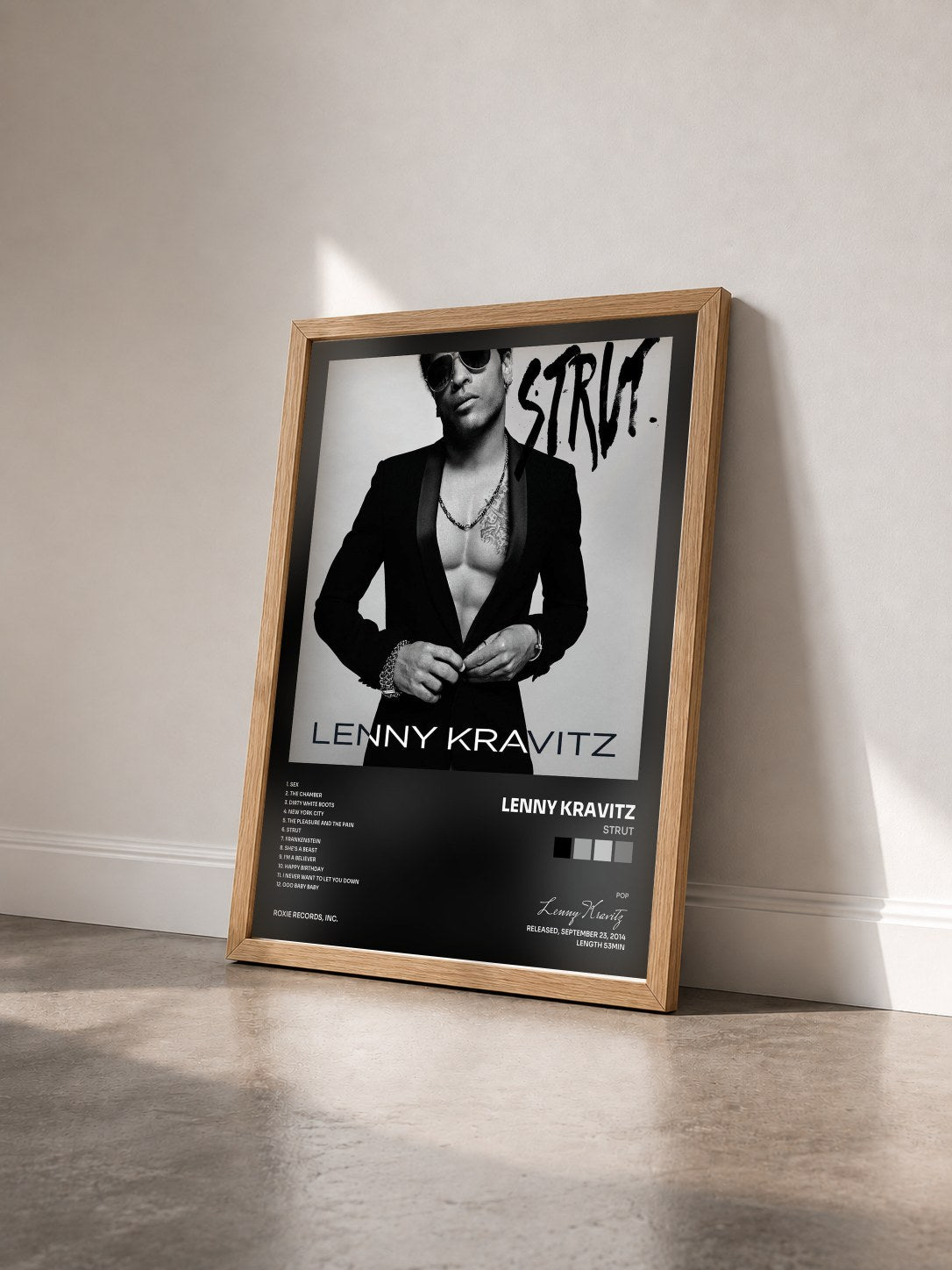 #bois Tableau de l'album Strut de Lenny Kravitz vu de trois quarts, cadre en bois brut