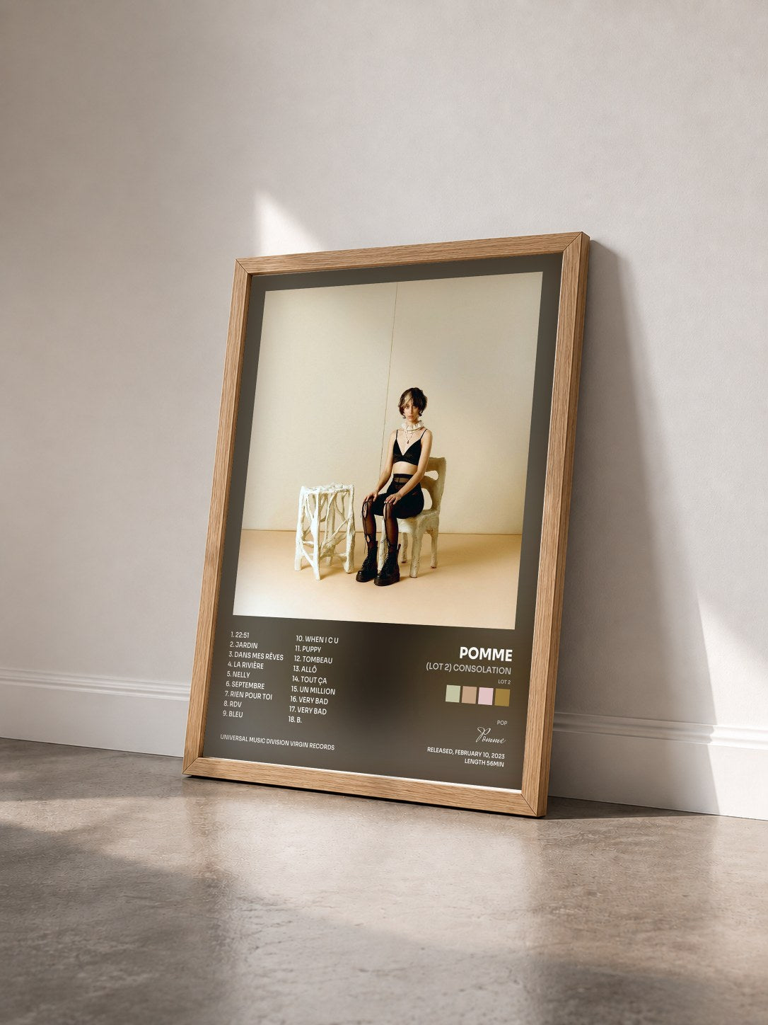#bois Tableau de l'album (Lot 2) consolation de Pomme vu de trois quarts, cadre en bois brut