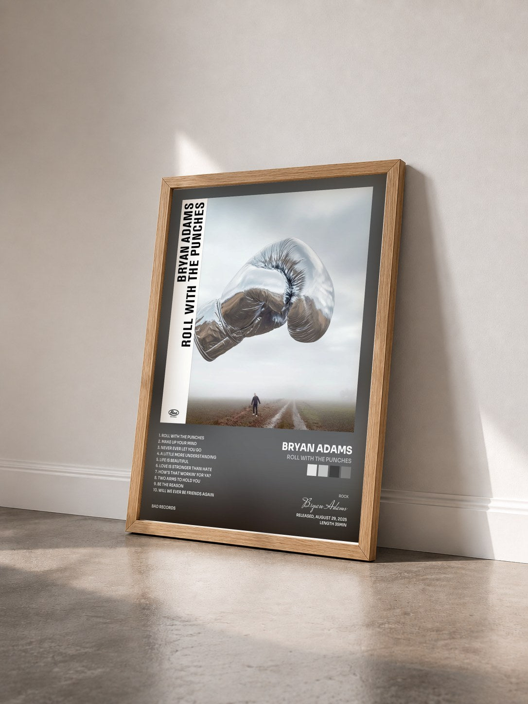 #bois Tableau de l'album Roll With The Punches de Bryan Adams vu de trois quarts, cadre en bois brut