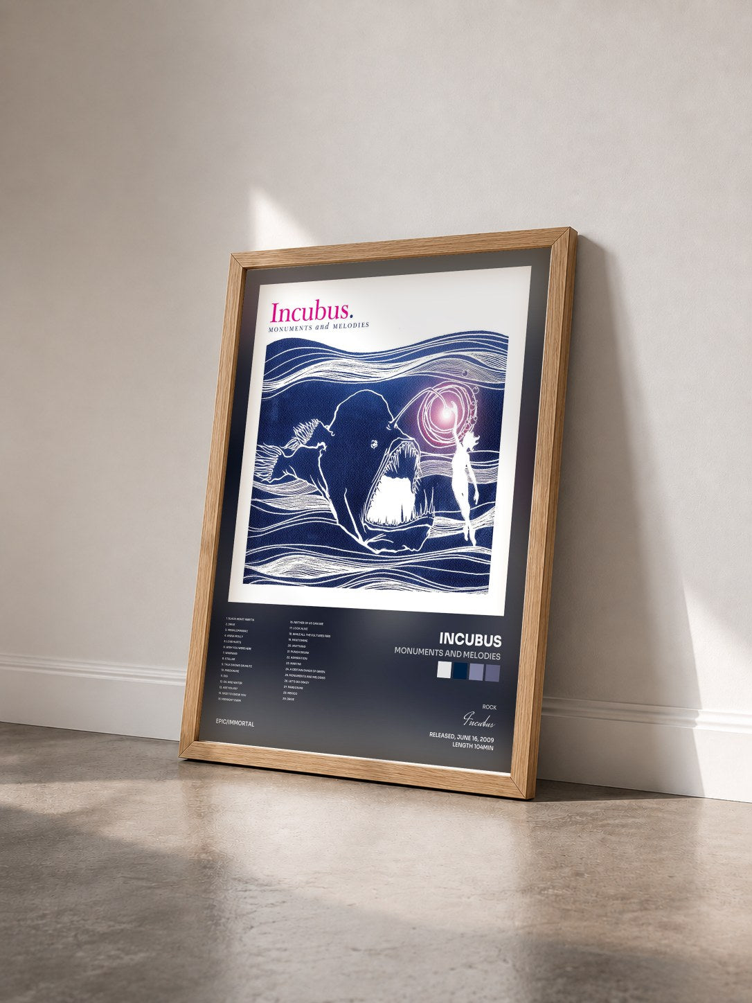 #bois Tableau de l'album Monuments And Melodies de Incubus vu de trois quarts, cadre en bois brut