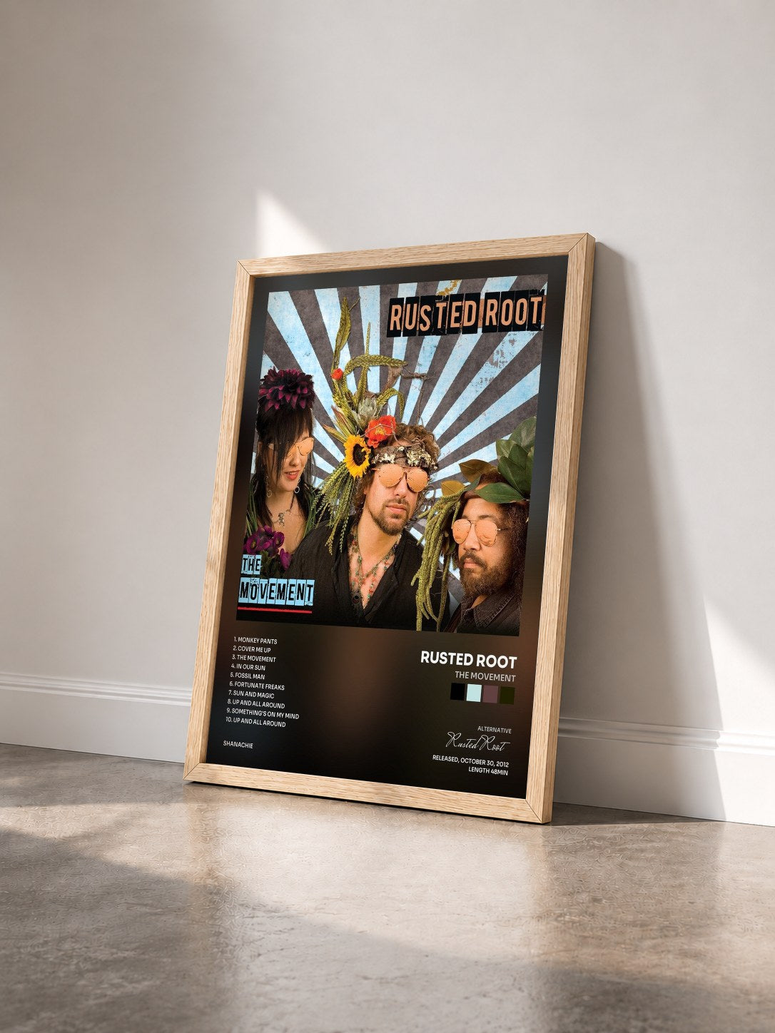 #bois Tableau de l'album The Movement de Rusted Root vu de trois quarts, cadre en bois brut