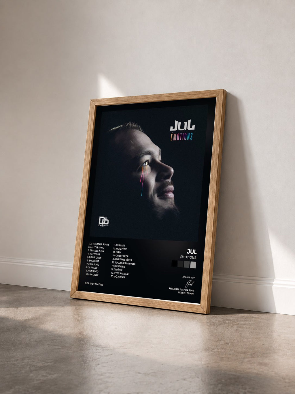 #bois Tableau de l'album Émotions de Jul vu de trois quarts, cadre en bois brut