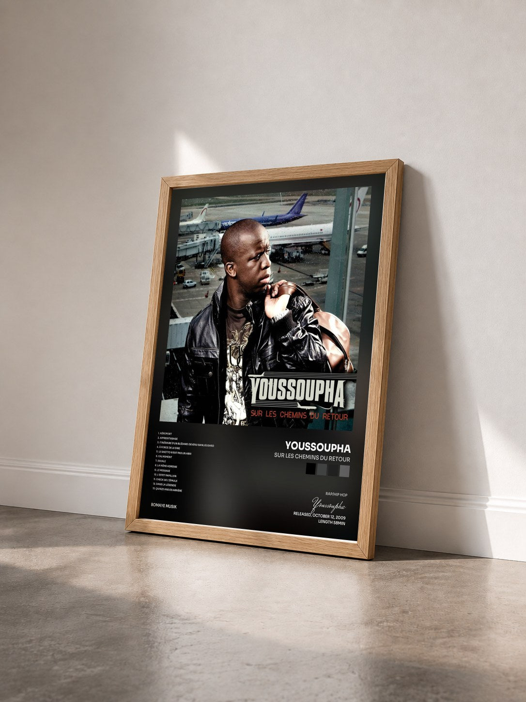 #bois Tableau de l'album Sur les chemins du retour de Youssoupha vu de trois quarts, cadre en bois brut