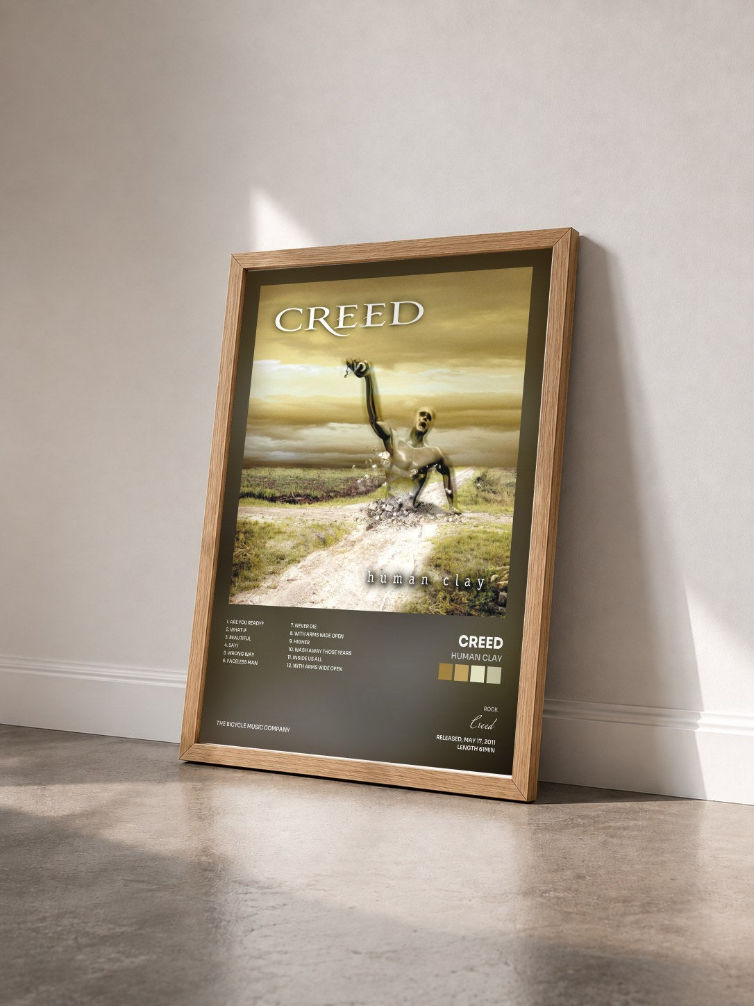 #bois Tableau de l'album Human Clay de Creed vu de trois quarts, cadre en bois brut
