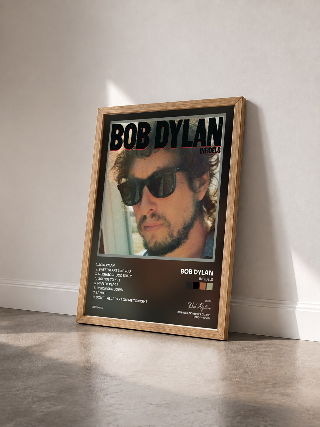 #bois Tableau de l'album Infidels de Bob Dylan vu de trois quarts, cadre en bois brut