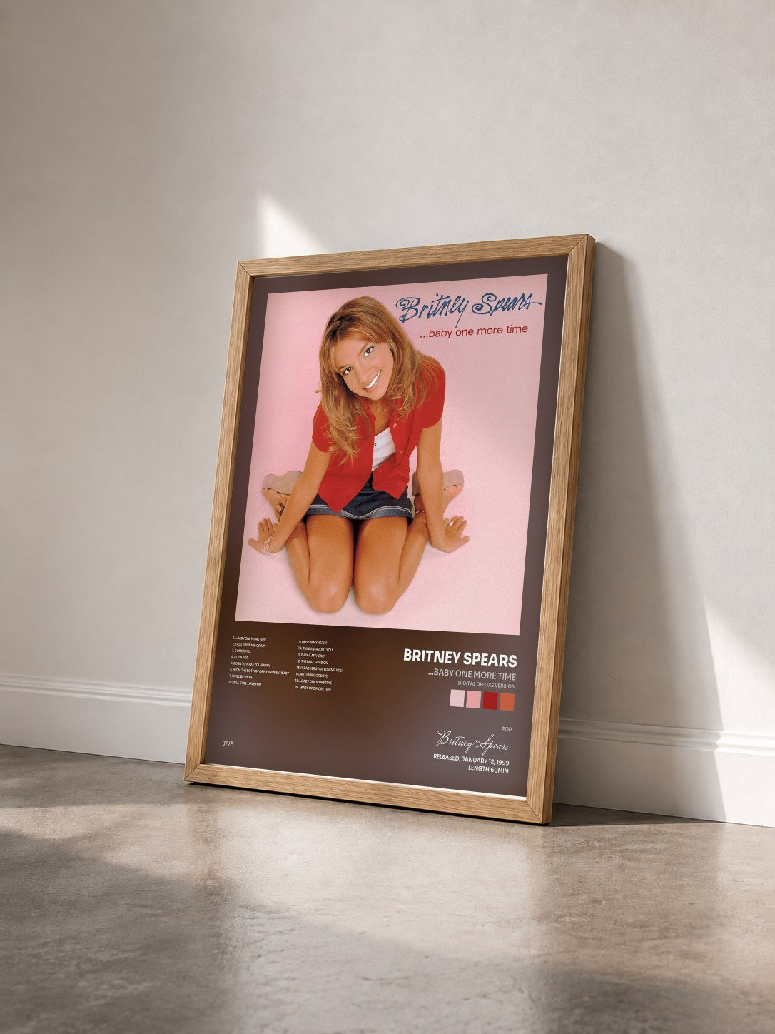 #bois Tableau de l'album ...Baby One More Time (Digital Deluxe Version) de Britney Spears vu de trois quarts, cadre en bois brut
