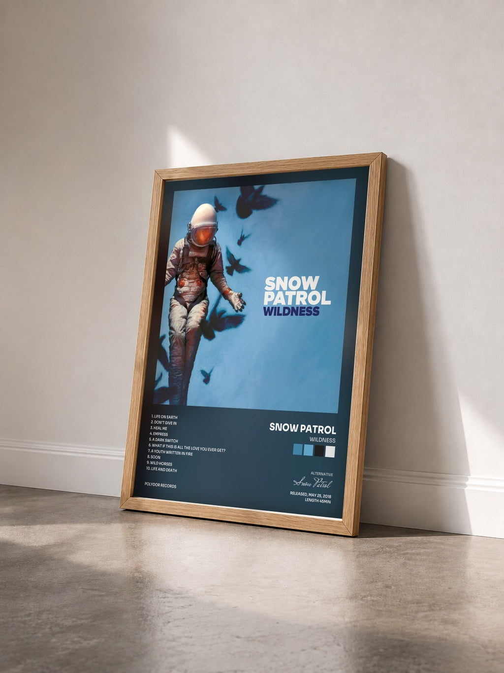 #bois Tableau de l'album Wildness de Snow Patrol vu de trois quarts, cadre en bois brut