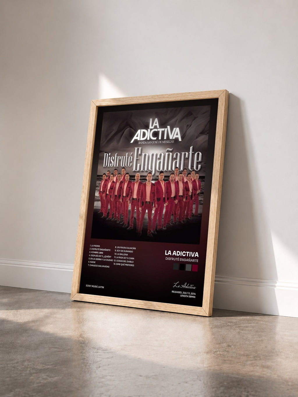 #bois Tableau de l'album Disfruté Engañarte de La Adictiva vu de trois quarts, cadre en bois brut