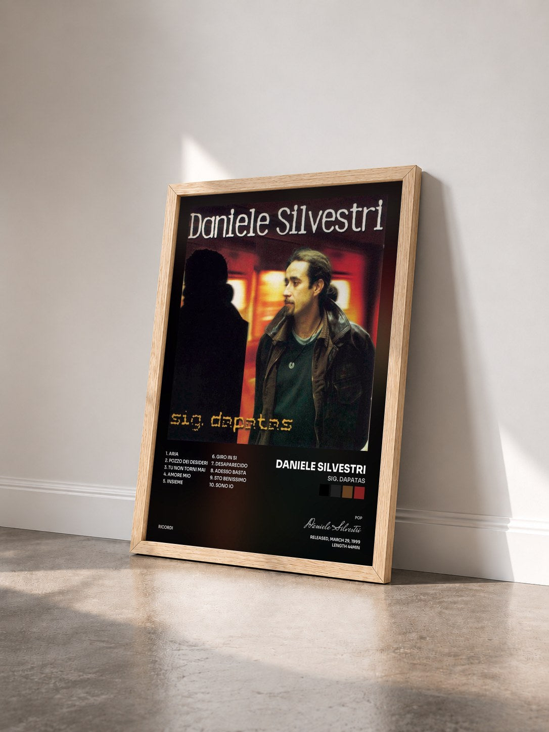 #bois Tableau de l'album Sig. Dapatas de Daniele Silvestri vu de trois quarts, cadre en bois brut