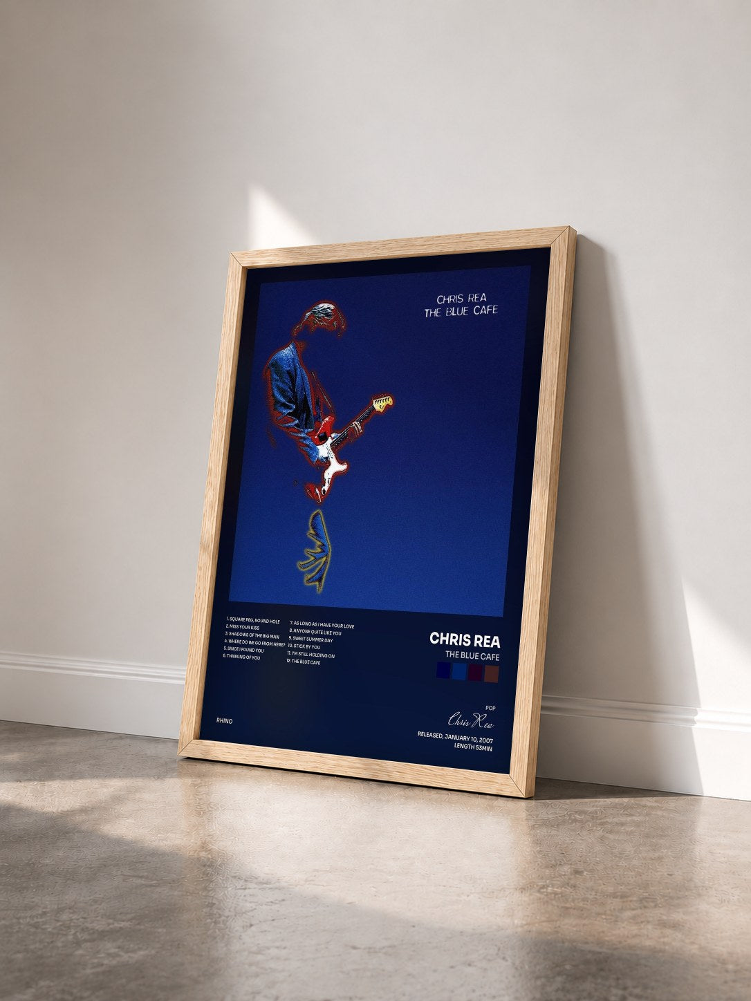 #bois Tableau de l'album The Blue Cafe de Chris Rea vu de trois quarts, cadre en bois brut