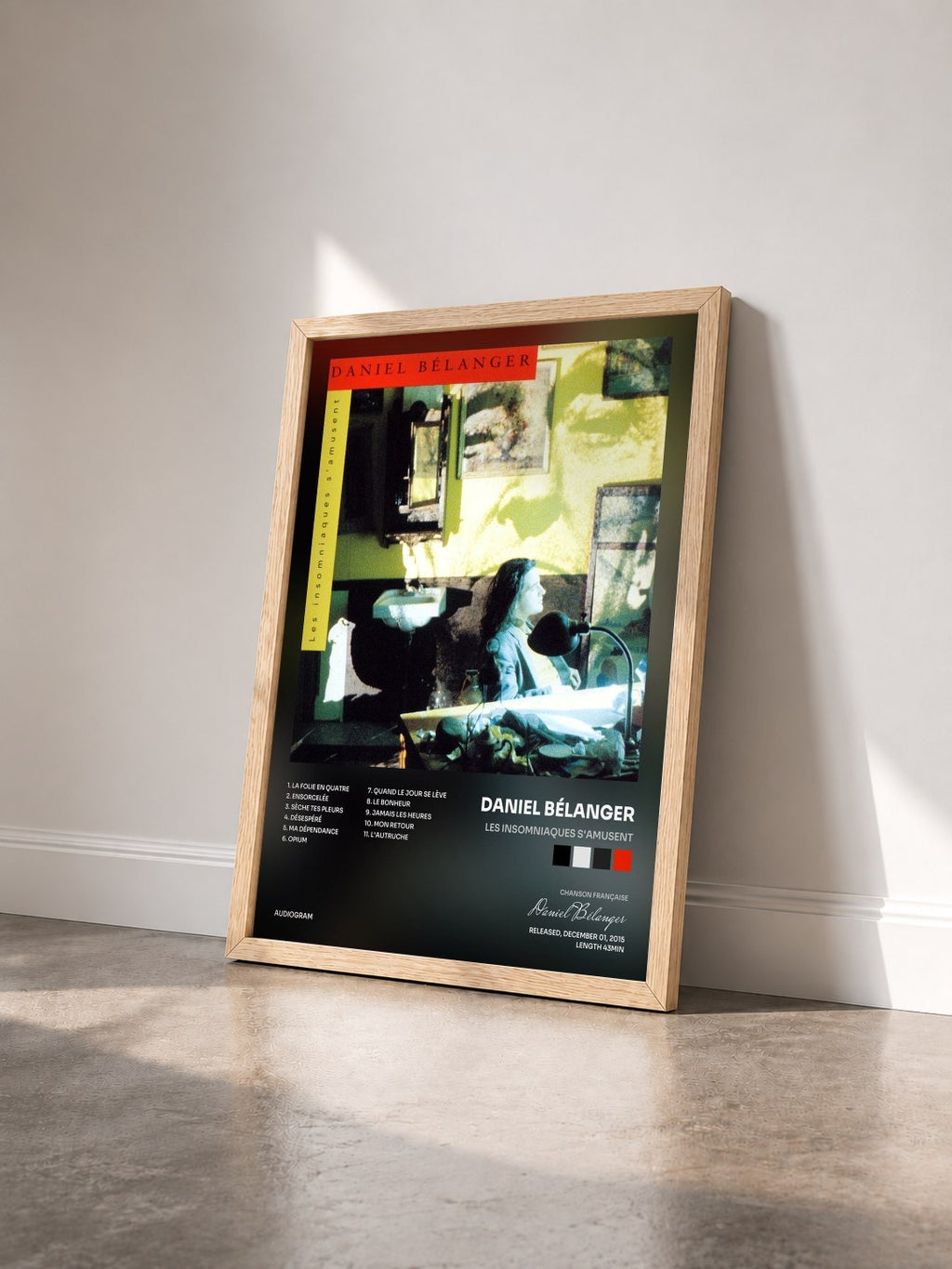 #bois Tableau de l'album Les Insomniaques S'amusent de Daniel Bélanger vu de trois quarts, cadre en bois brut