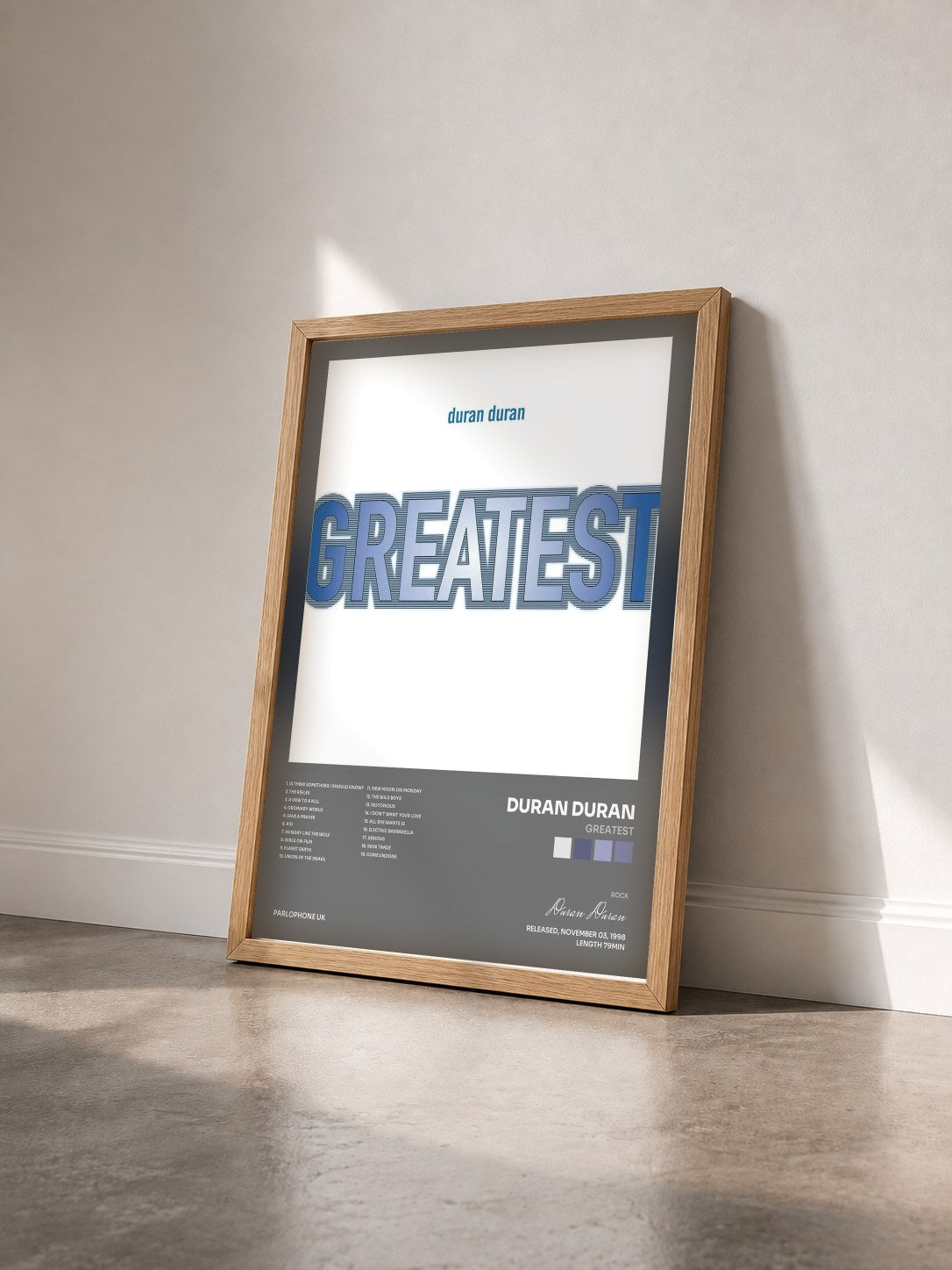 #bois Tableau de l'album Greatest de Duran Duran vu de trois quarts, cadre en bois brut