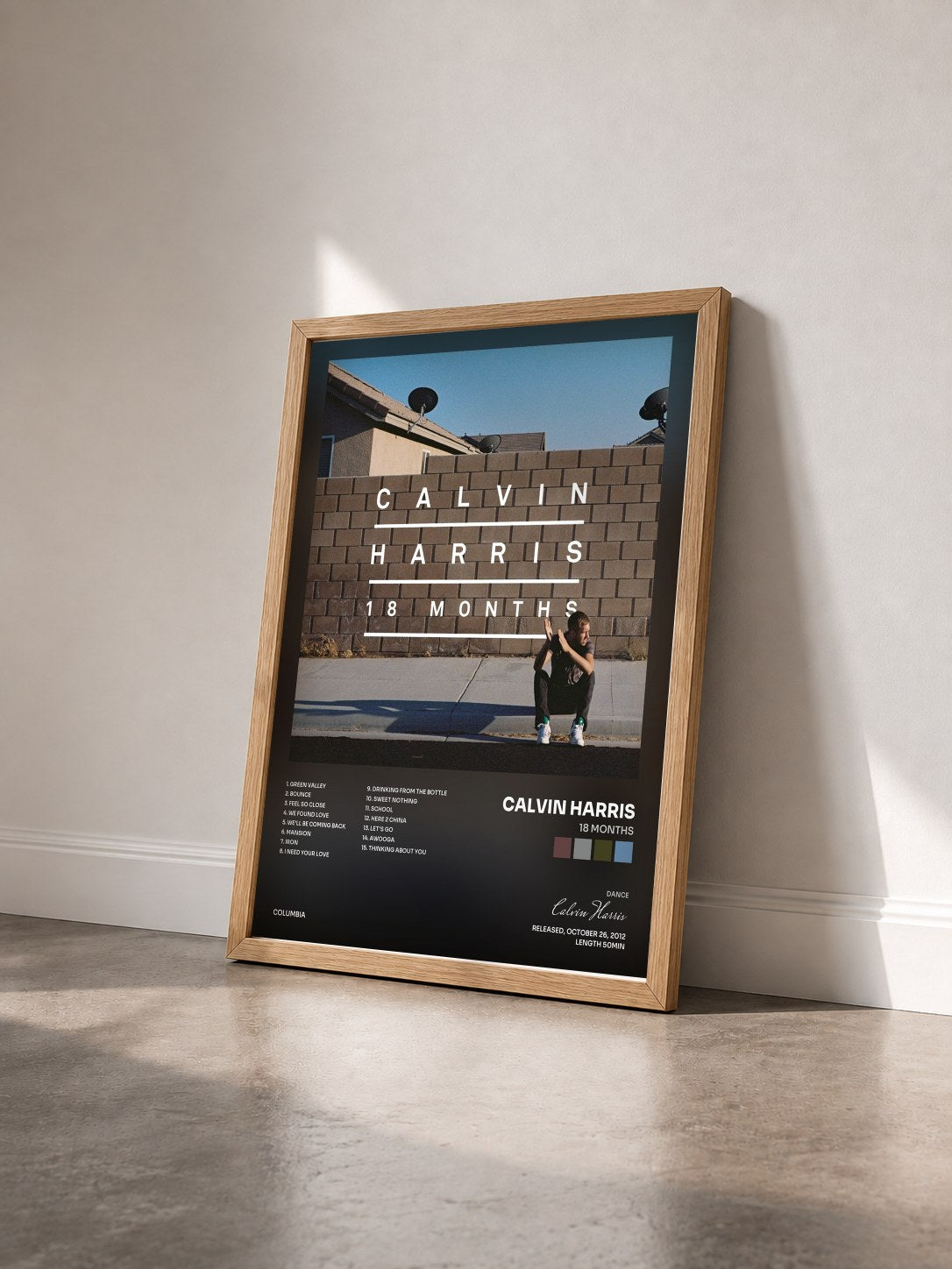 #bois Tableau de l'album 18 Months de Calvin Harris vu de trois quarts, cadre en bois brut