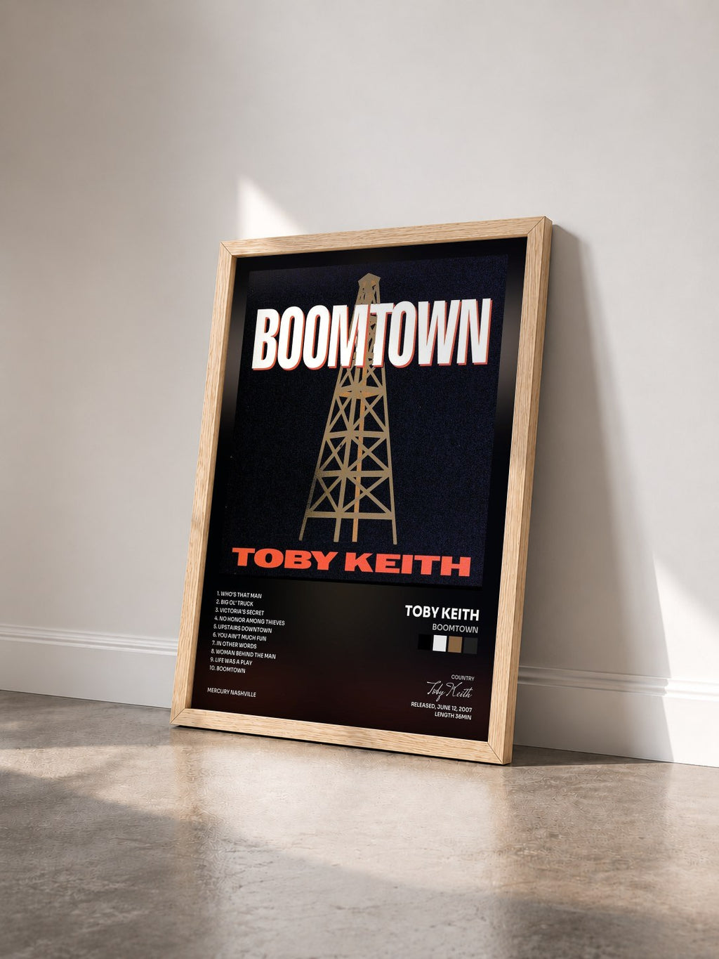 #bois Tableau de l'album Boomtown de Toby Keith vu de trois quarts, cadre en bois brut