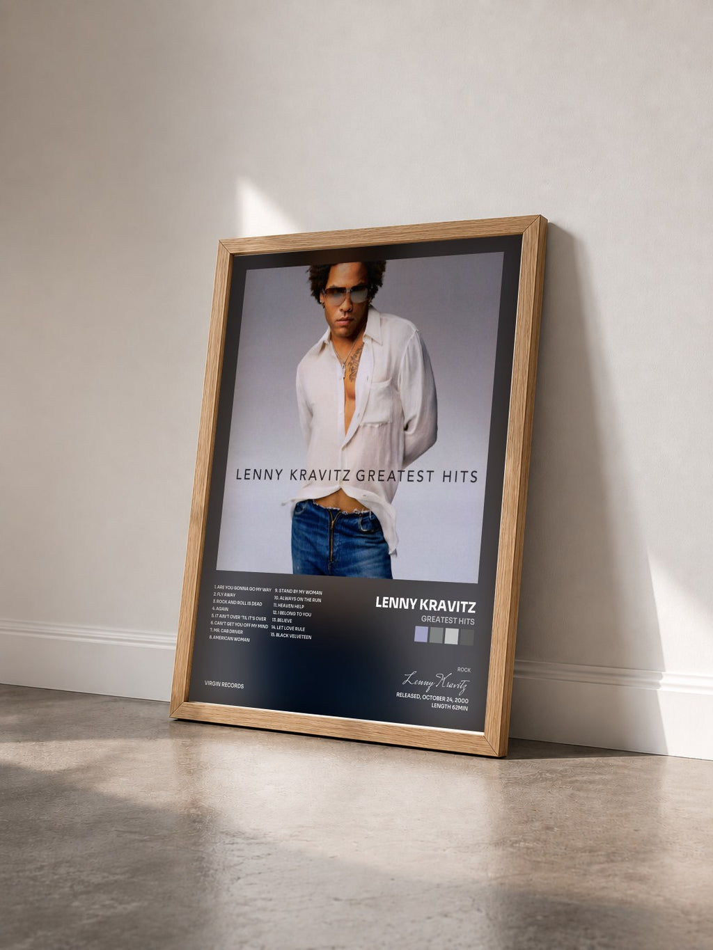 #bois Tableau de l'album Greatest Hits de Lenny Kravitz vu de trois quarts, cadre en bois brut