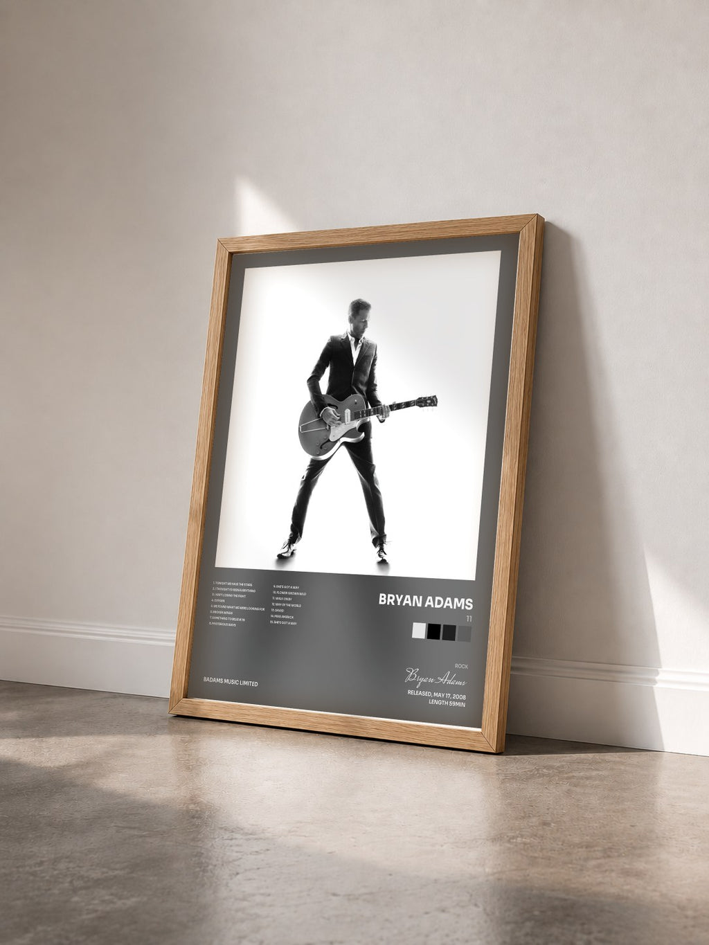 #bois Tableau de l'album 11 de Bryan Adams vu de trois quarts, cadre en bois brut