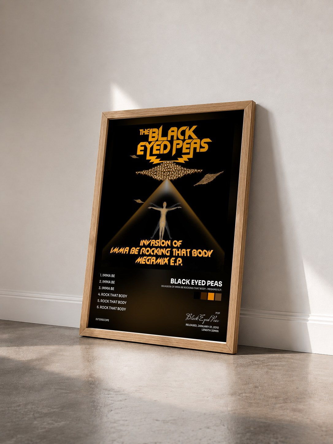 #bois Tableau de l'album Invasion Of Imma Be Rocking That Body - Megamix E.P. de Black Eyed Peas vu de trois quarts, cadre en bois brut