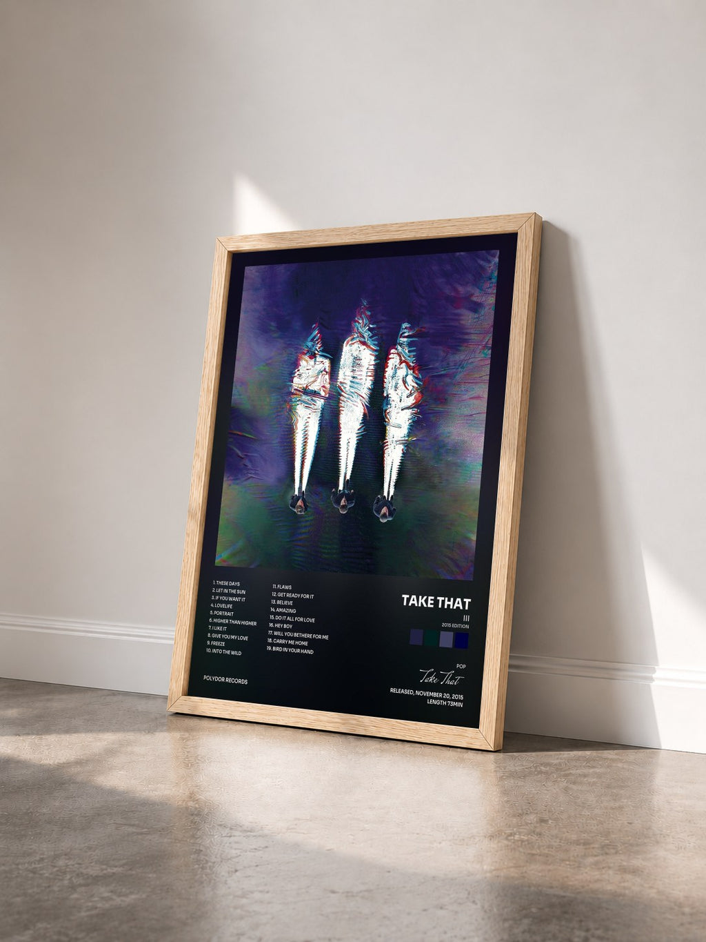 #bois Tableau de l'album III (2015 Edition) de Take That vu de trois quarts, cadre en bois brut