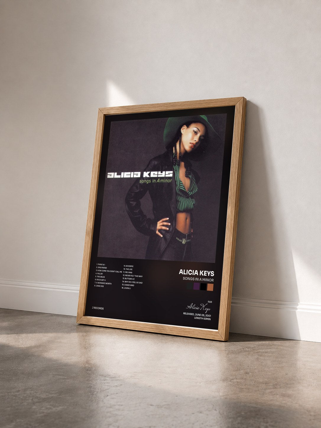 #bois Tableau de l'album Songs In A Minor de Alicia Keys vu de trois quarts, cadre en bois brut