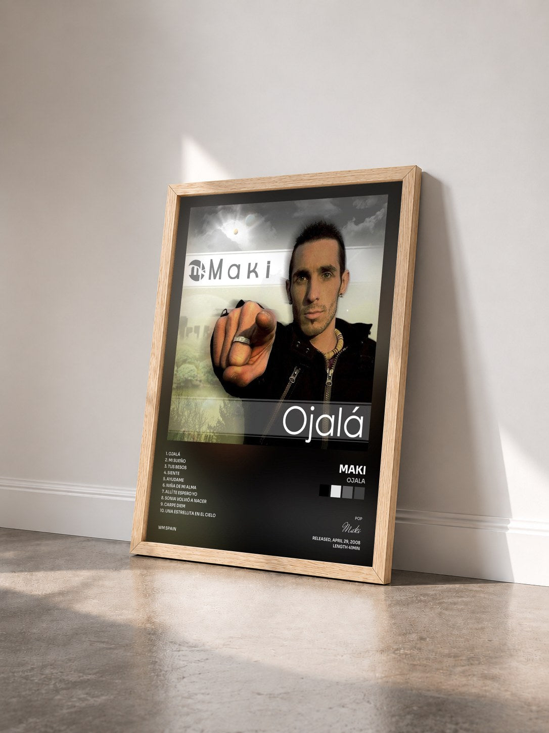 #bois Tableau de l'album Ojala de Maki vu de trois quarts, cadre en bois brut