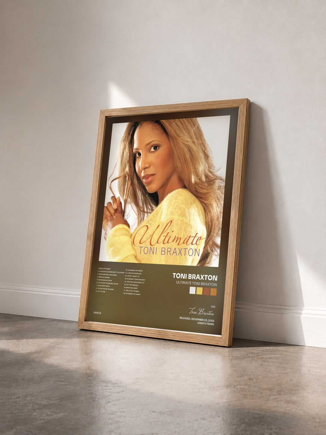 #bois Tableau de l'album Ultimate Toni Braxton de Toni Braxton vu de trois quarts, cadre en bois brut