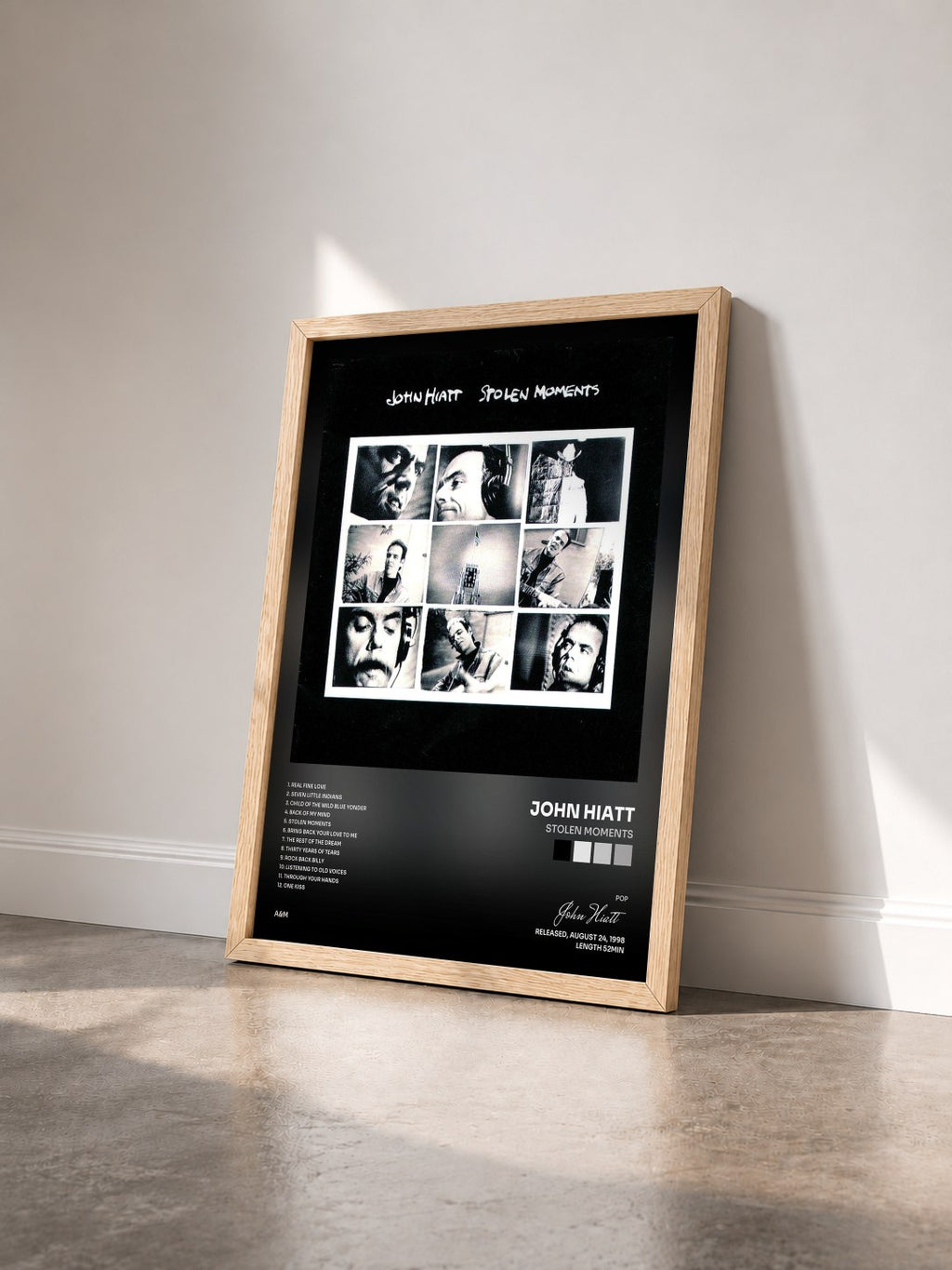 #bois Tableau de l'album Stolen Moments de John Hiatt vu de trois quarts, cadre en bois brut