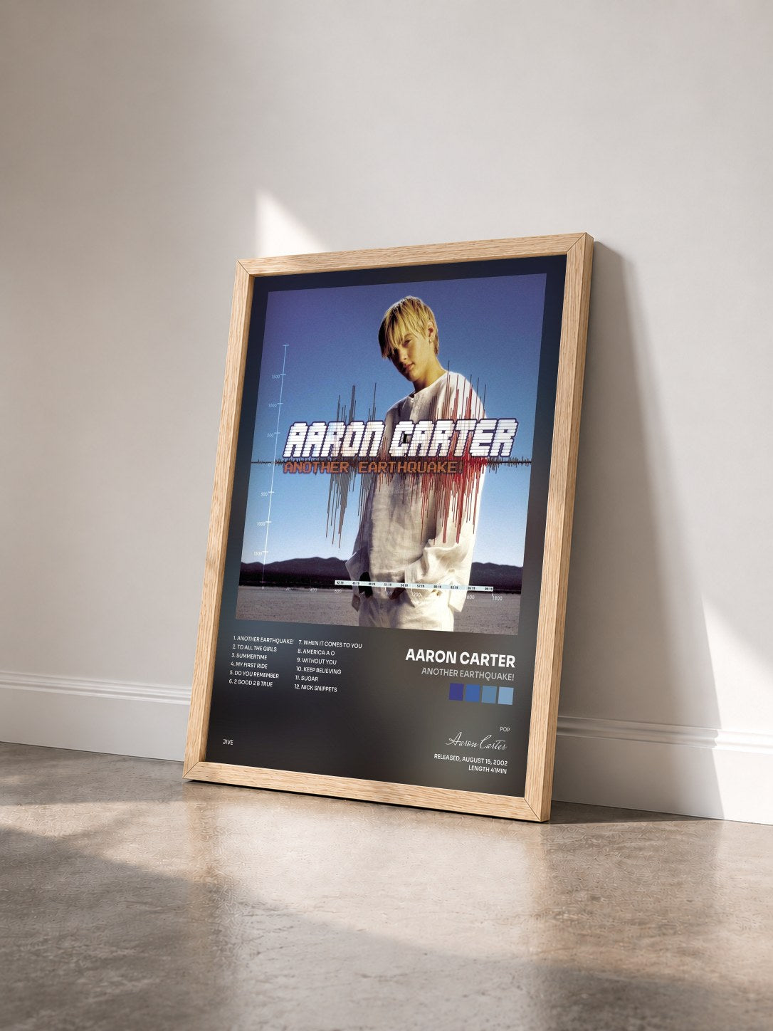 #bois Tableau de l'album Another Earthquake! de Aaron Carter vu de trois quarts, cadre en bois brut