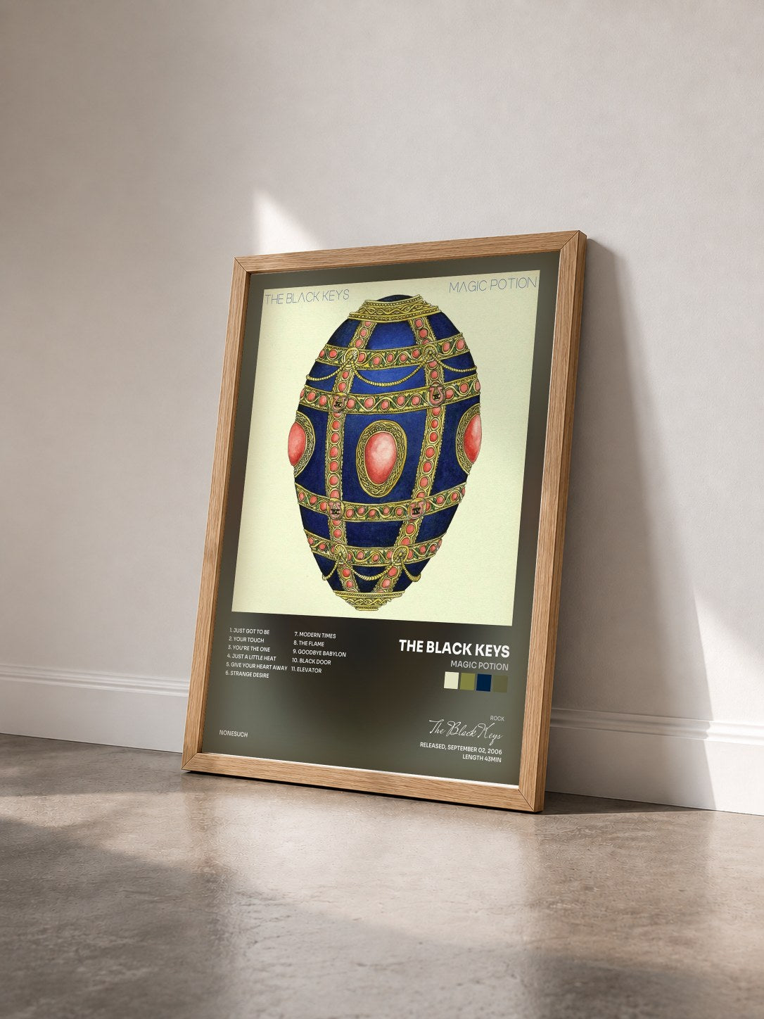 #bois Tableau de l'album Magic Potion de The Black Keys vu de trois quarts, cadre en bois brut