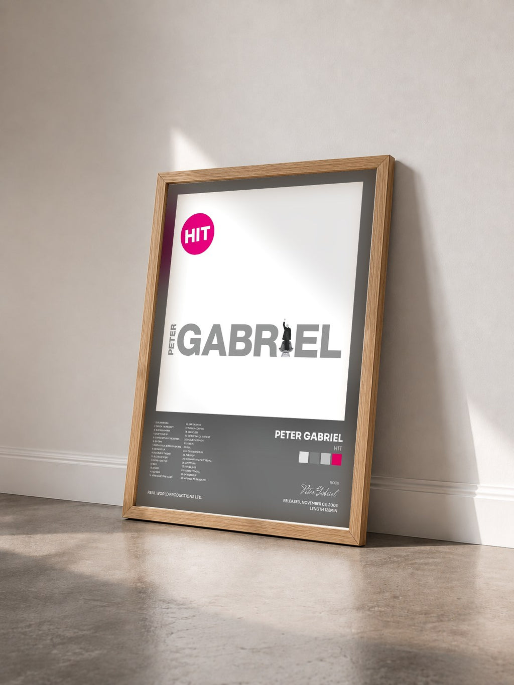 #bois Tableau de l'album Hit de Peter Gabriel vu de trois quarts, cadre en bois brut