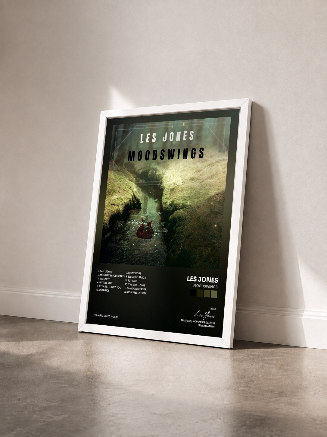 #blanc Tableau de l'album Moodswings de Les Jones vu de trois quarts, cadre blanc