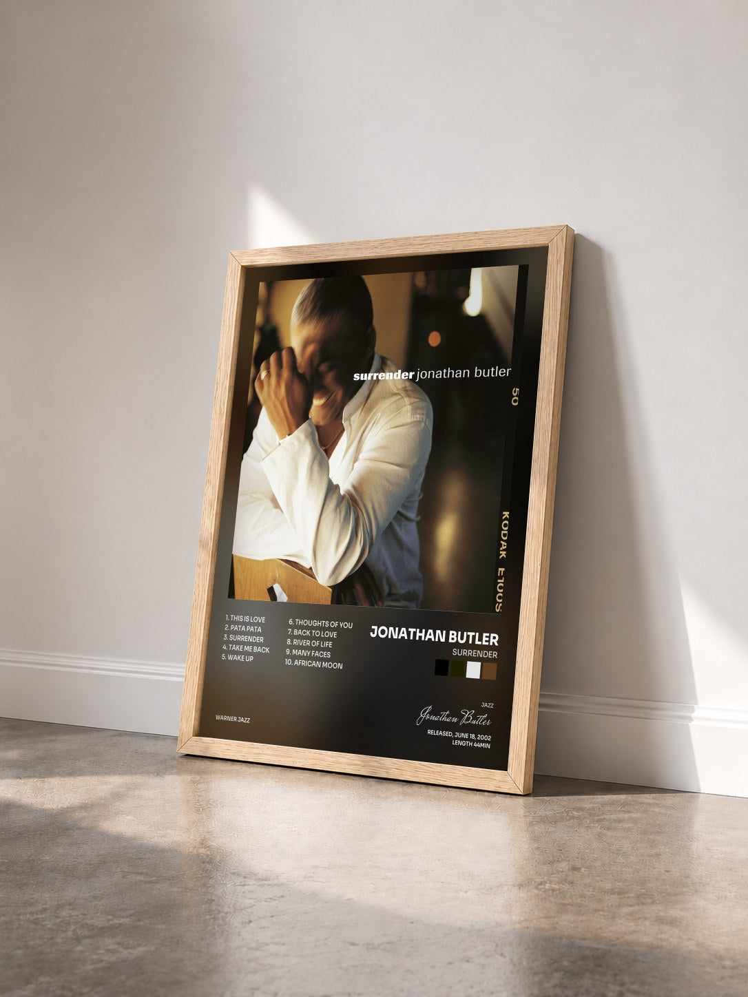 #bois Tableau de l'album Surrender de Jonathan Butler vu de trois quarts, cadre en bois brut