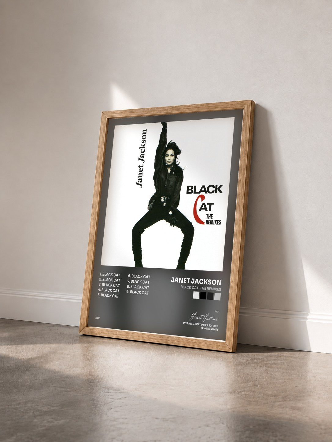 #bois Tableau de l'album Black Cat: The Remixes de Janet Jackson vu de trois quarts, cadre en bois brut