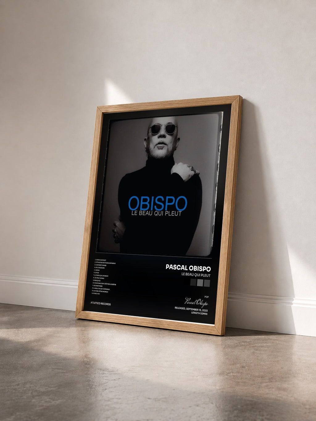 #bois Tableau de l'album Le beau qui pleut de Pascal Obispo vu de trois quarts, cadre en bois brut