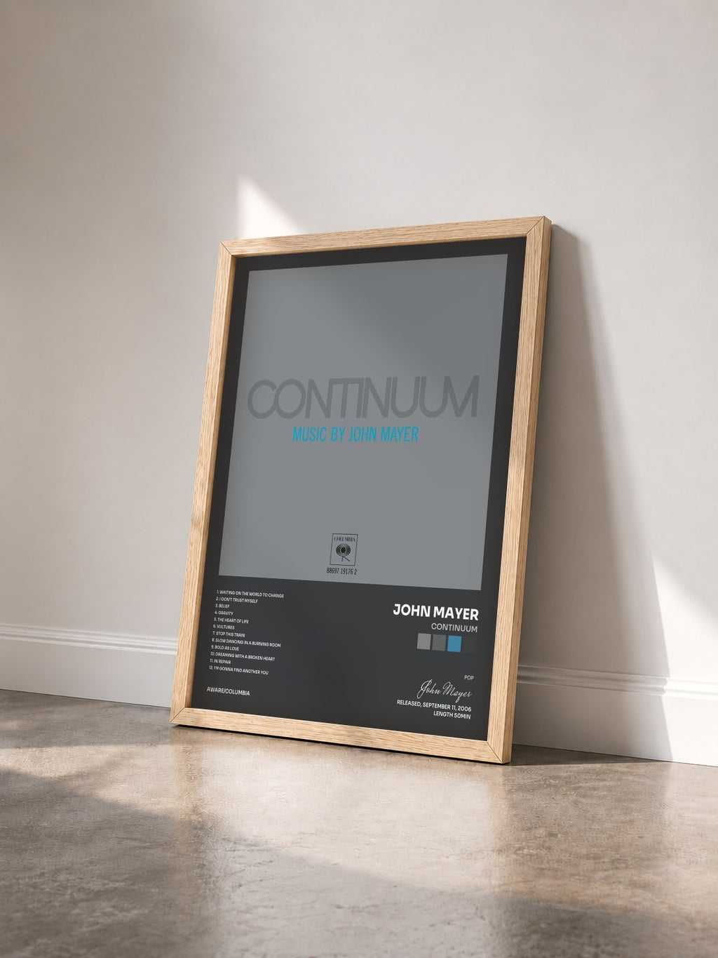 #bois Tableau de l'album Continuum de John Mayer vu de trois quarts, cadre en bois brut
