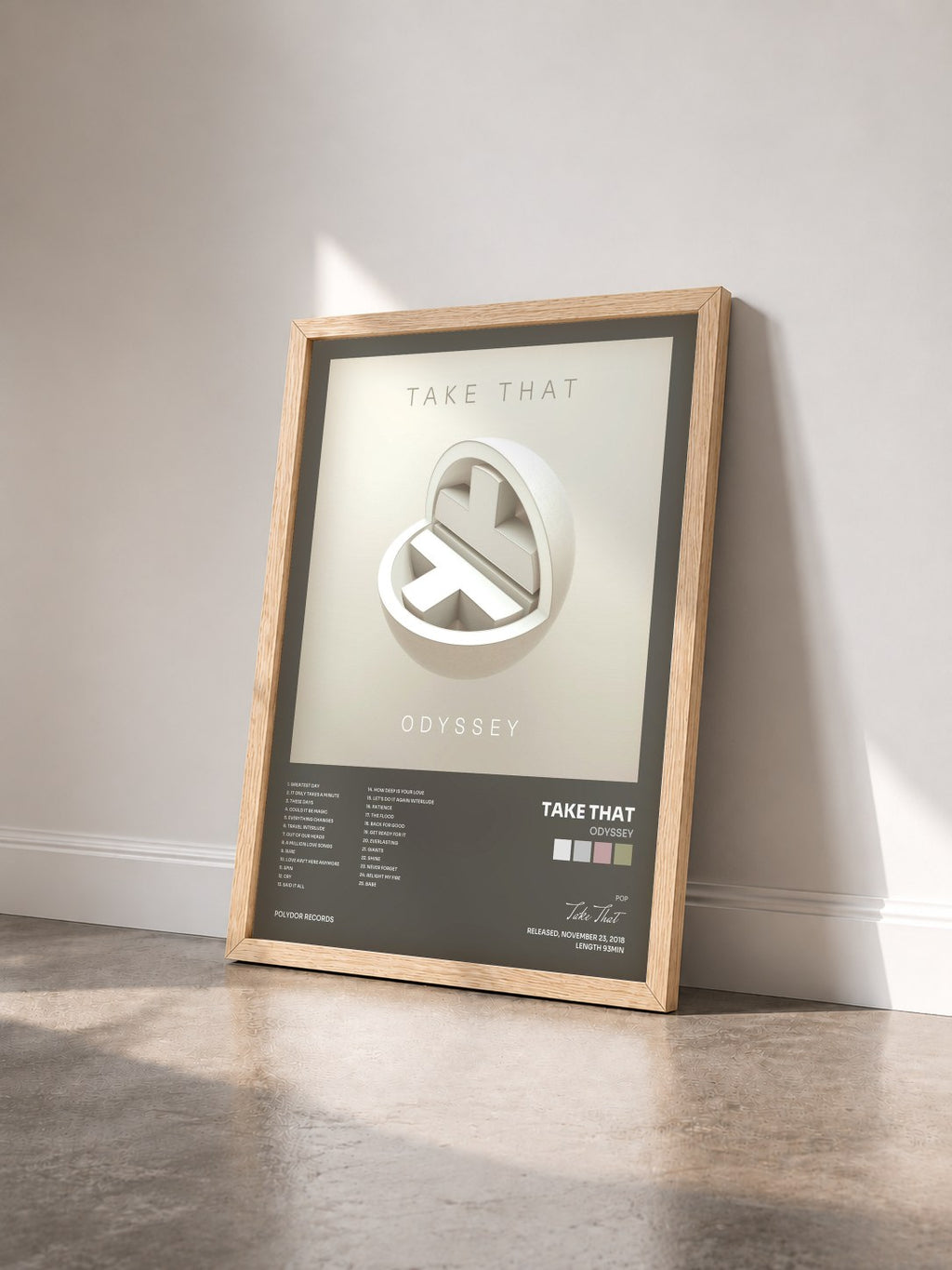 #bois Tableau de l'album Odyssey de Take That vu de trois quarts, cadre en bois brut