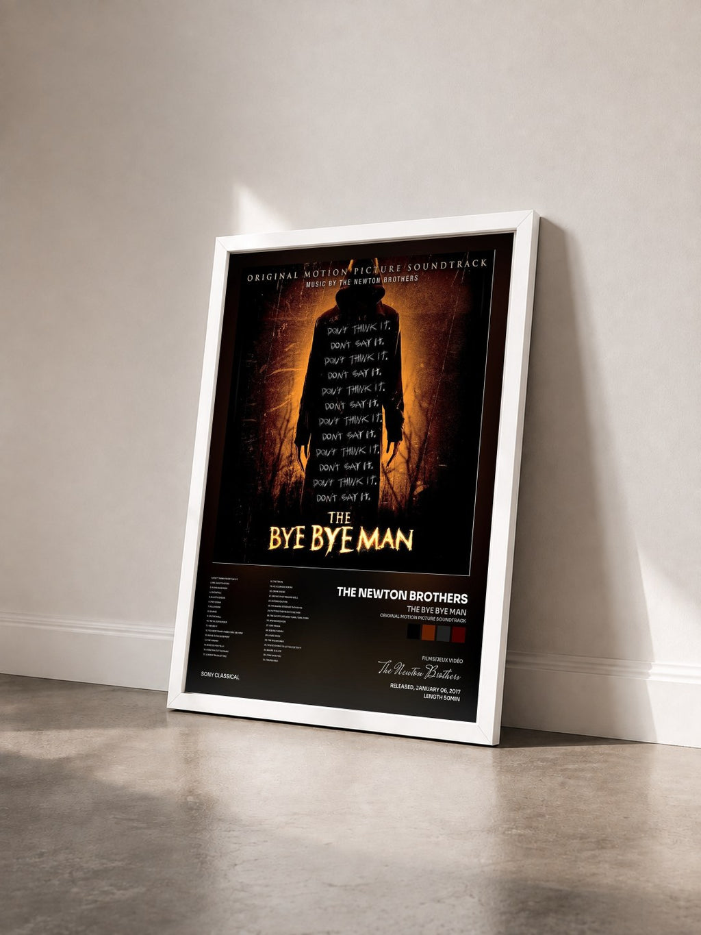 #blanc Tableau de l'album The Bye Bye Man (Original Motion Picture Soundtrack) de The Newton Brothers vu de trois quarts, cadre blanc