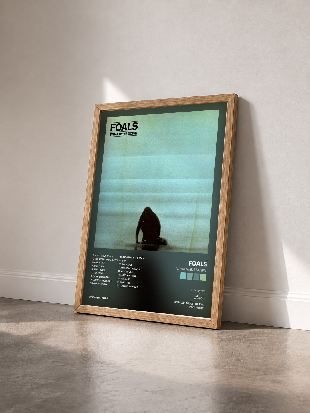 #bois Tableau de l'album What Went Down de Foals vu de trois quarts, cadre en bois brut