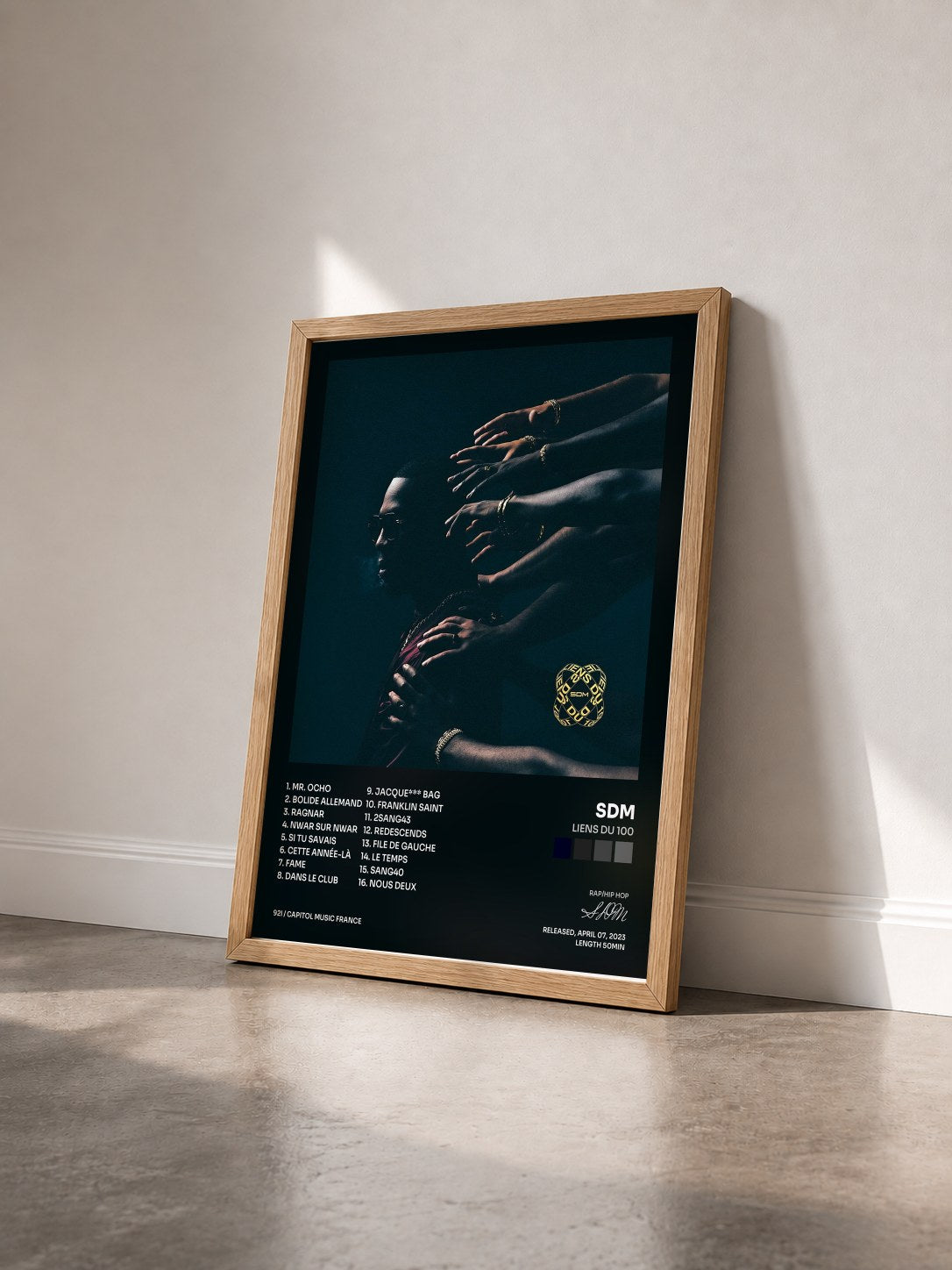 #bois Tableau de l'album Liens du 100 de SDM vu de trois quarts, cadre en bois brut