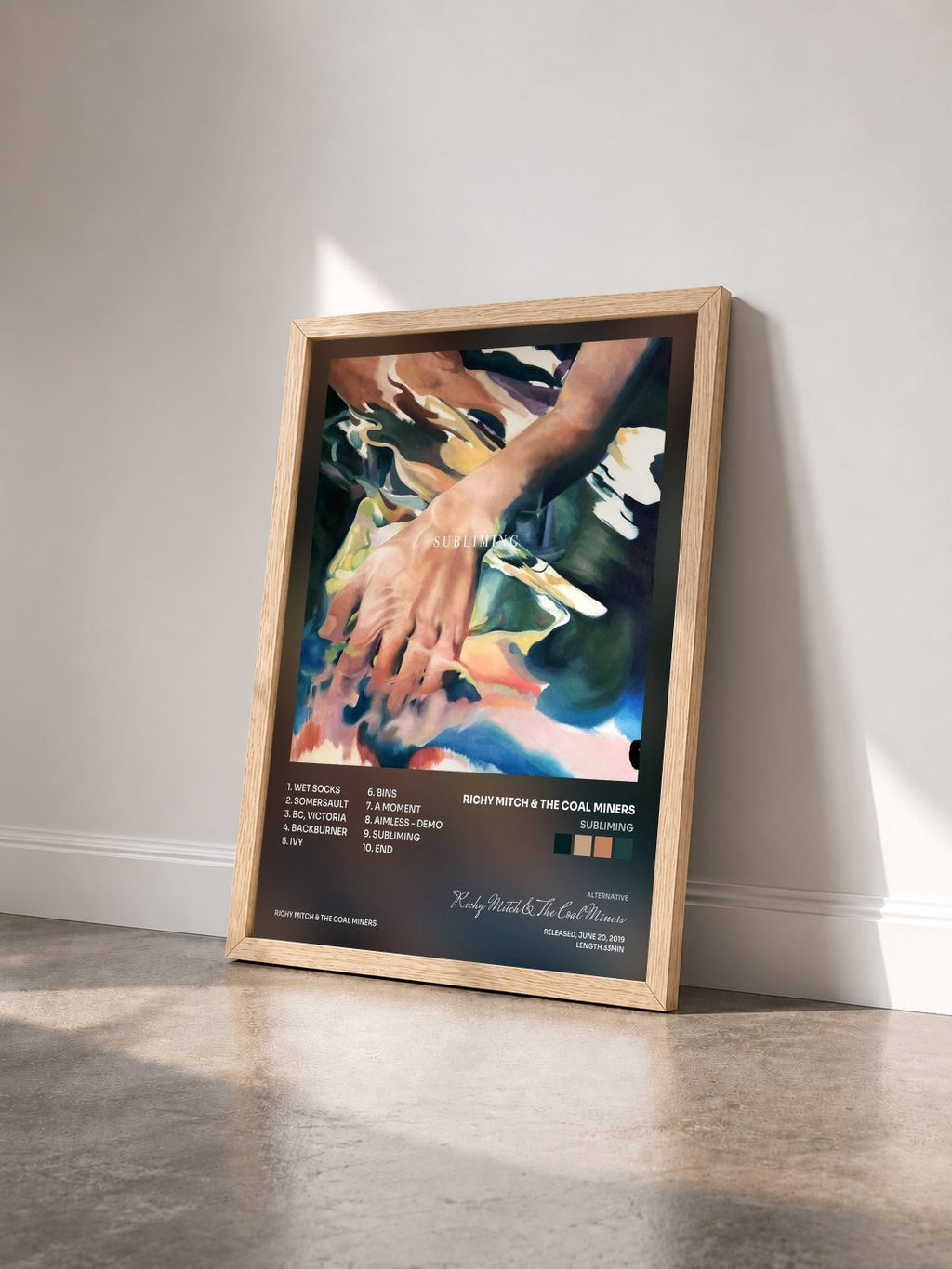 #bois Tableau de l'album Subliming de Richy Mitch & The Coal Miners vu de trois quarts, cadre en bois brut
