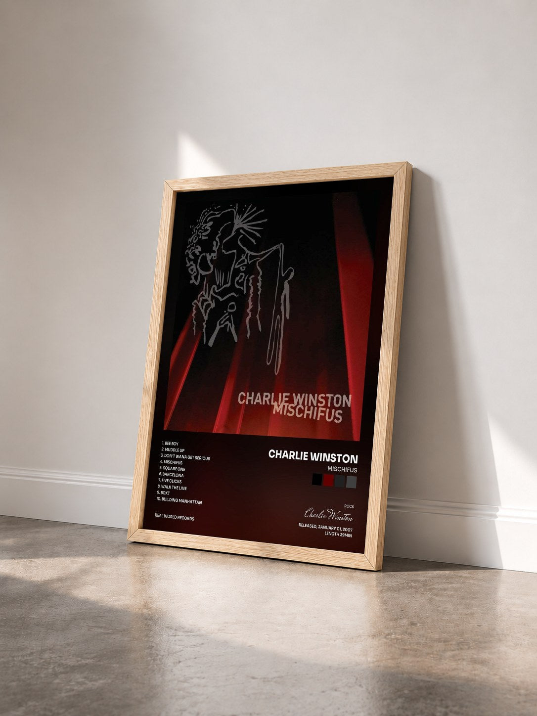 #bois Tableau de l'album Mischifus de Charlie Winston vu de trois quarts, cadre en bois brut