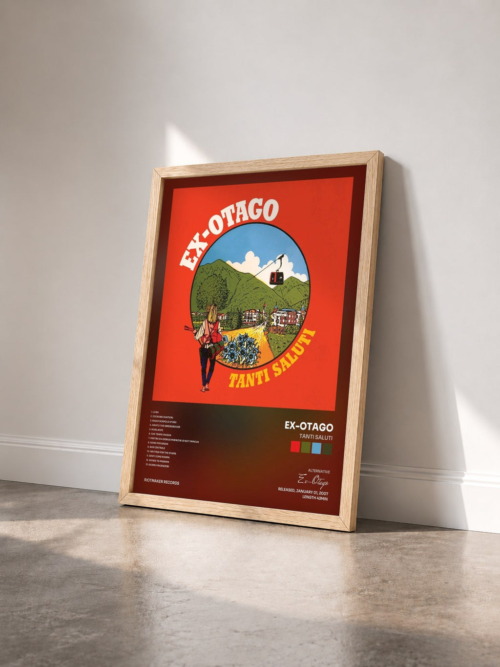 #bois Tableau de l'album Tanti Saluti de Ex-Otago vu de trois quarts, cadre en bois brut
