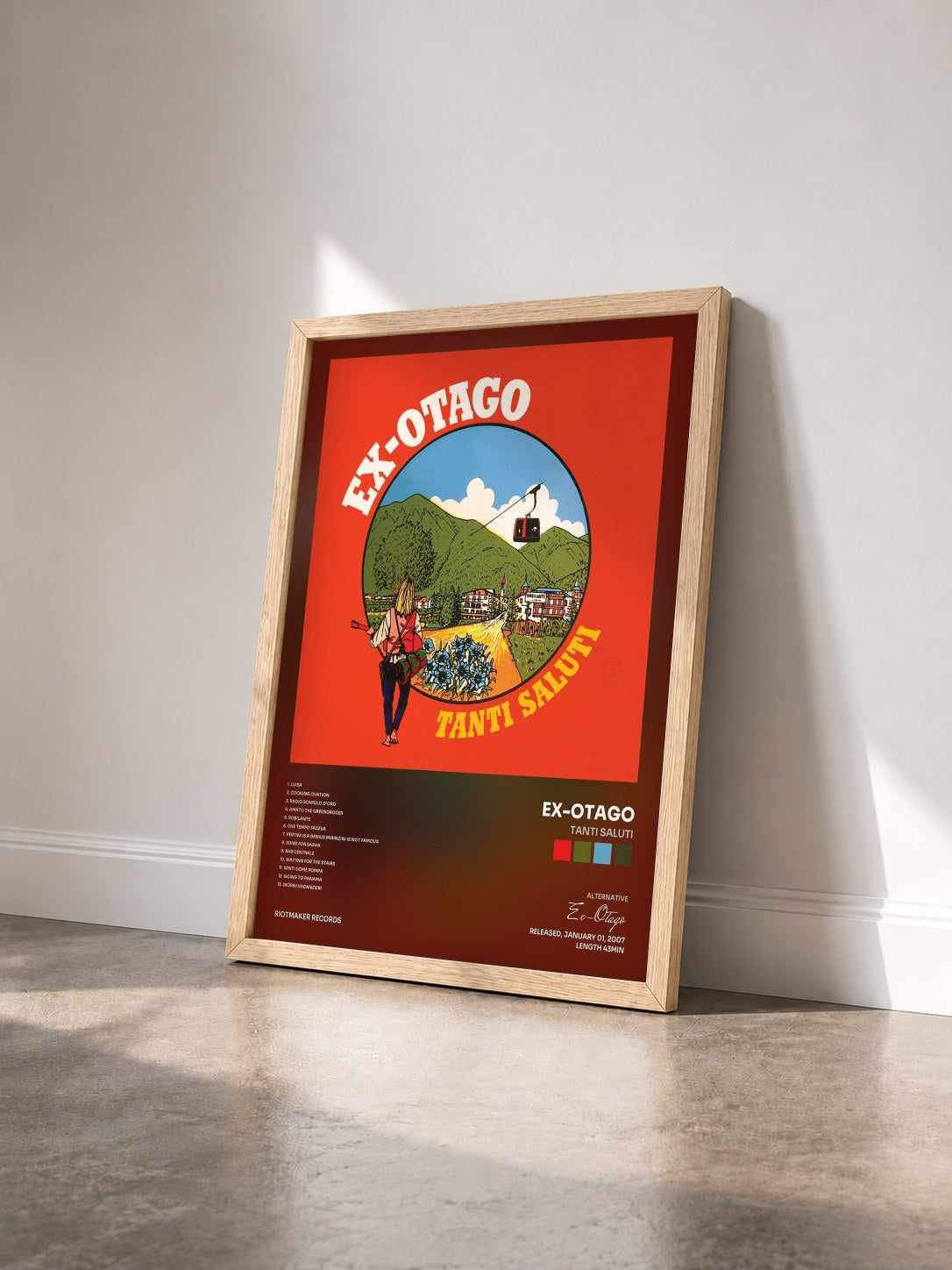 #bois Tableau de l'album Tanti Saluti de Ex-Otago vu de trois quarts, cadre en bois brut