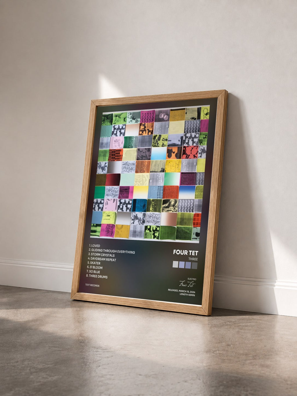 #bois Tableau de l'album Three de Four Tet vu de trois quarts, cadre en bois brut
